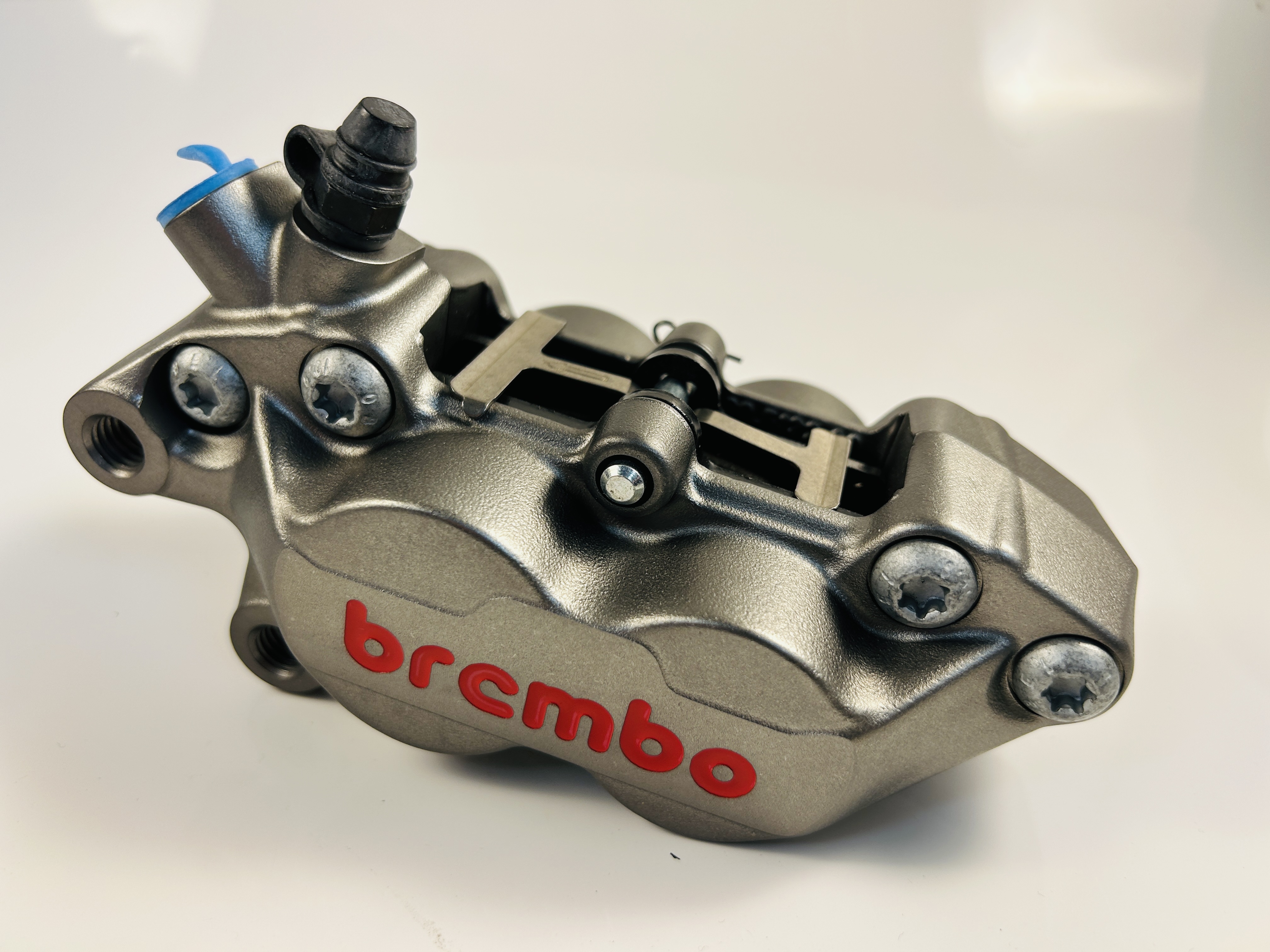 Brembo P4-30/34 Caliper front left with pads colour titanium 40mm mounting